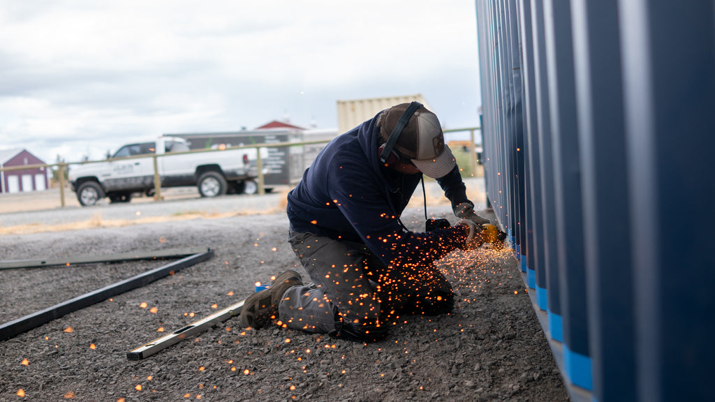 Cascade Crate's Team Member Modifying A Shipping Container
