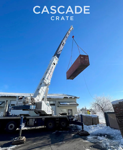 Crane lifting a 40' shipping Container